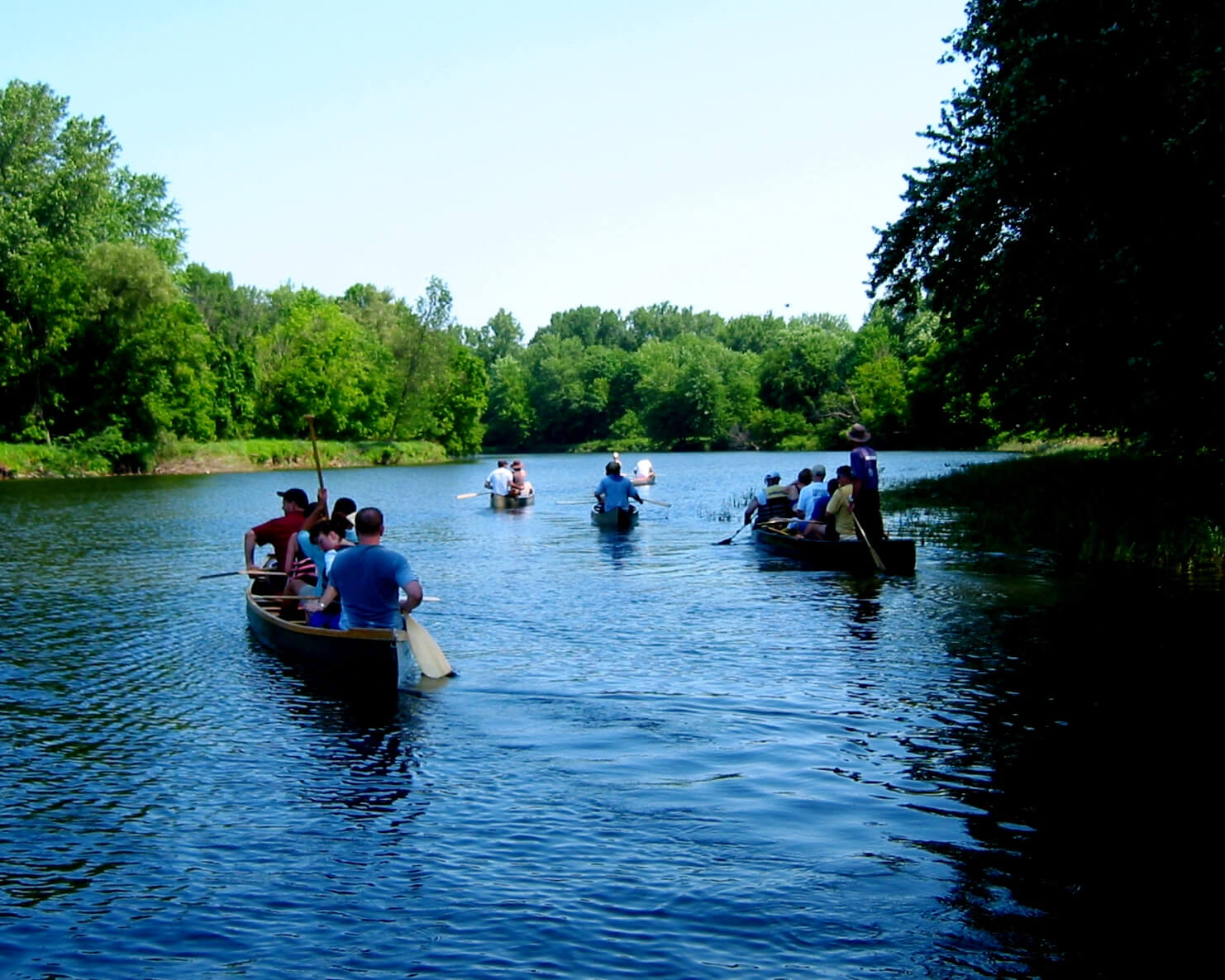 Group of canoes riding down the river
