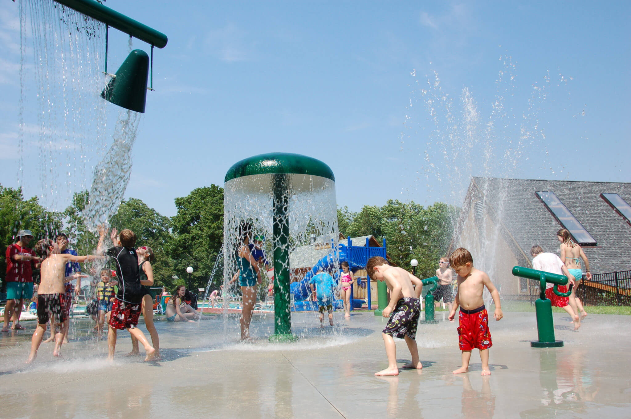group of guest children playing in the outdoor splash pad