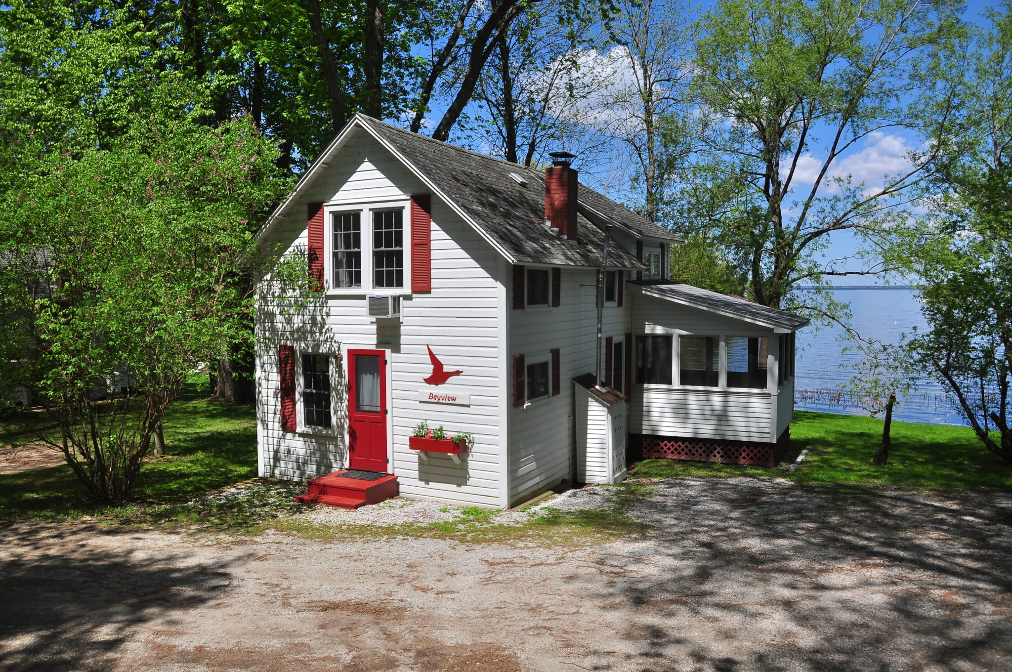 Red and white cottage overlooking Kingfisher Bay