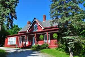red cottage on a hill