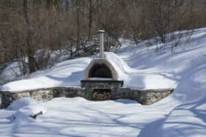 Outdoor kitchen covered in snow